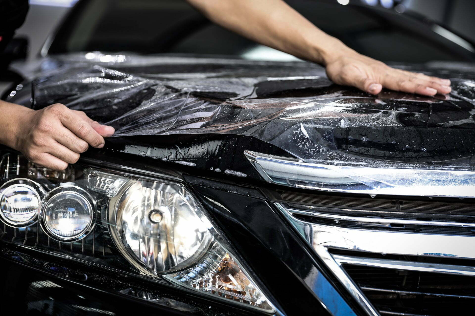 a black shining car after get paint protection film at classic details auto spa in sanford fl